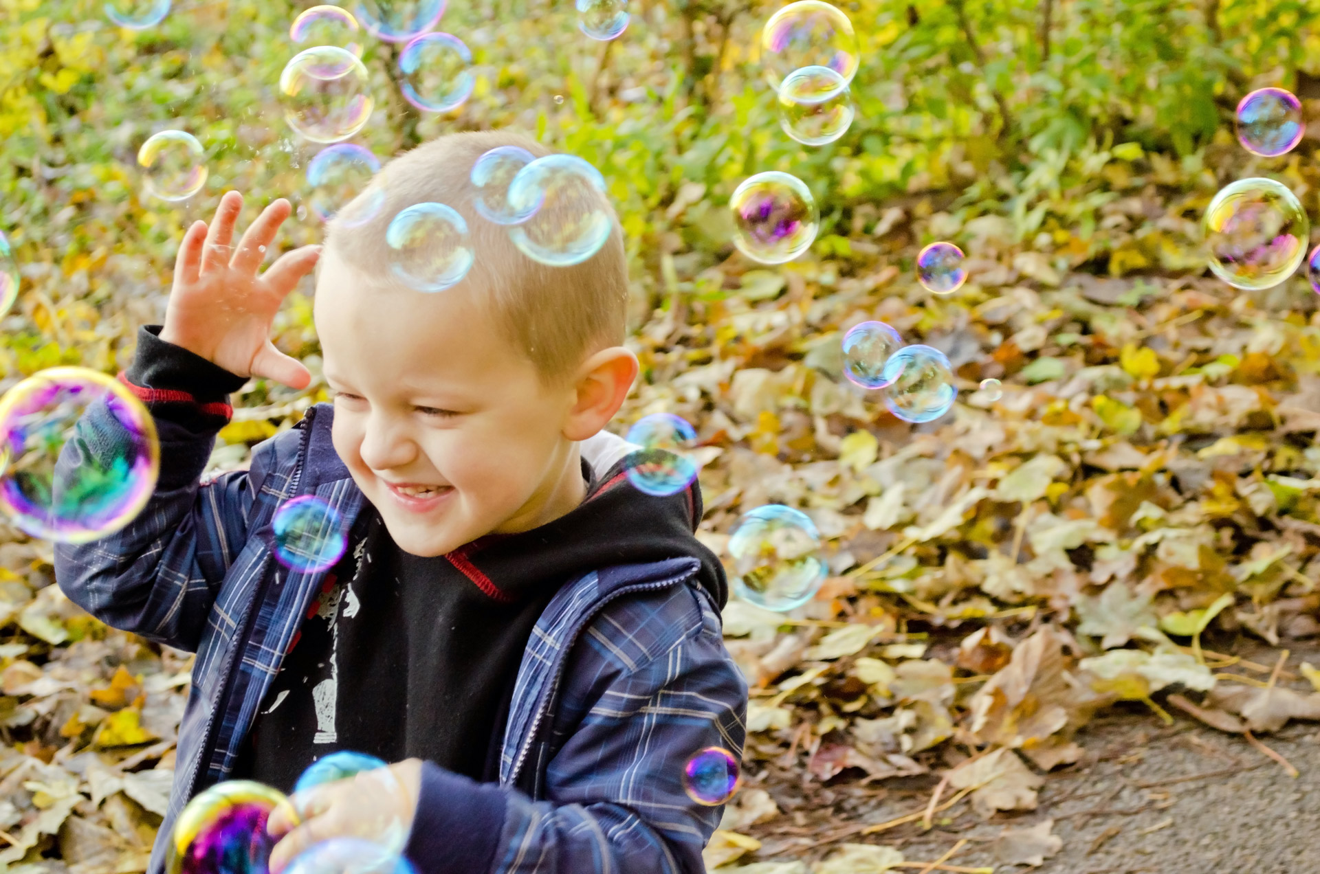 boy playing with bubbles
